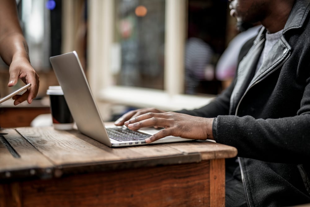 Businessman-working-remotely-from-cafe-1
