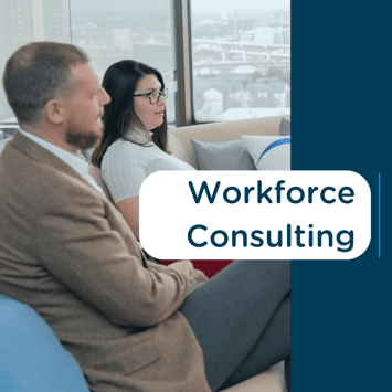 Two professionals discussing in a high-rise office with text 